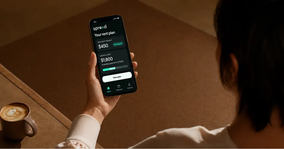 Renter reviewing Spread statement history on a phone.