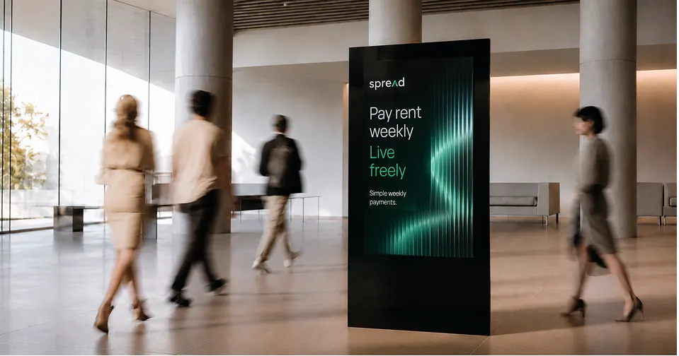 Digital display in a lobby advertising weekly rent payments.